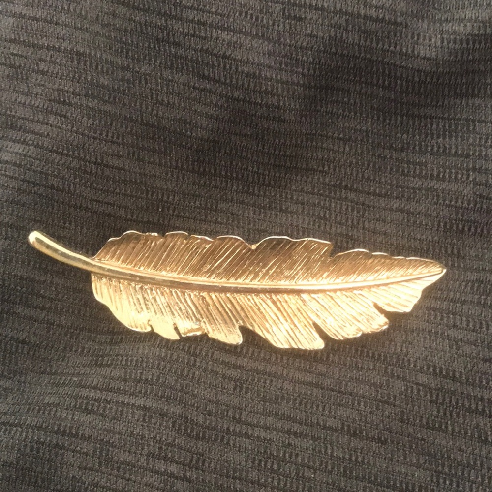 Gold feather hair accessory